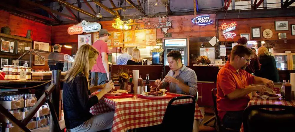 Photo of people eating at a barbecue restaurant.