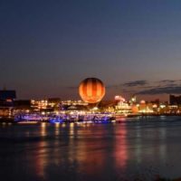 Landscape photo of Disney Springs at night.