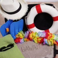 Photo of an open suitcase filled with sand with 