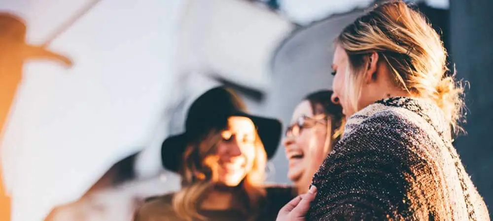 Photo of 3 women laughing.