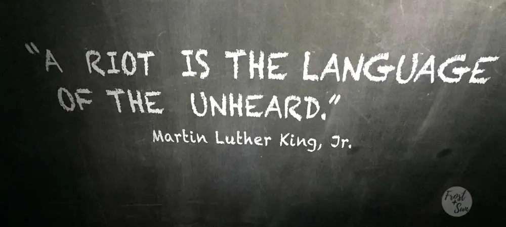 Photo of a mural at The Center for Civil and Human Rights in Atlanta. The mural reads "A riot is the language of the unheard." and is attributed to Martin Luther King, Jr.