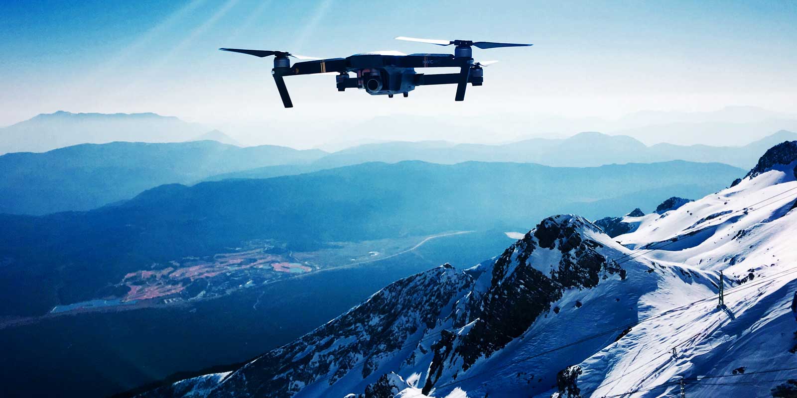 Film your outdoor adventures, such as a hike in these mountains, with a photography drone.