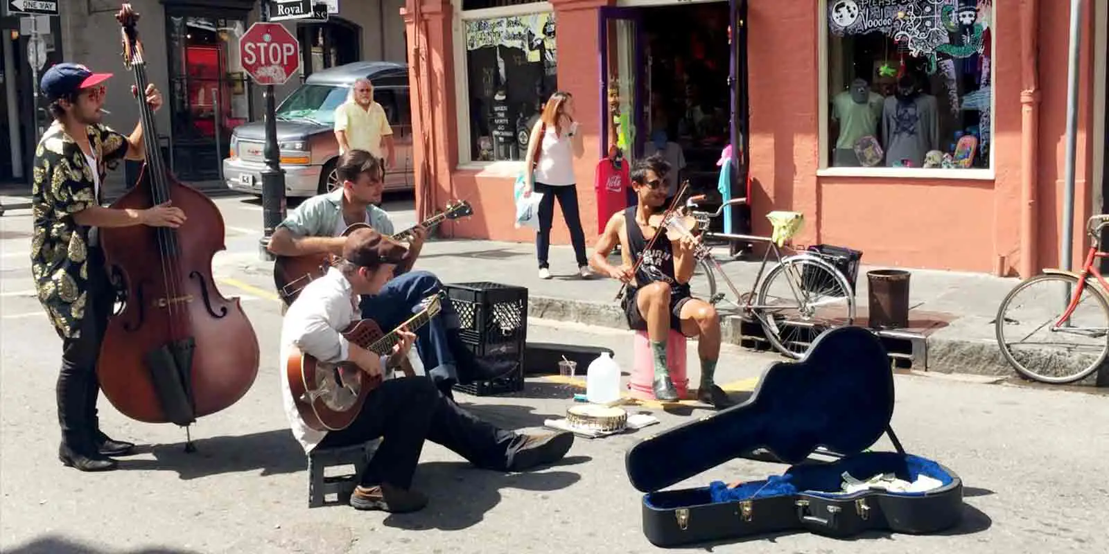 New Orleans travel tips: Street musicians perform on Royal St. in the New Orleans' French Quarter. If you stop to listen to a street musician, leave a tip!