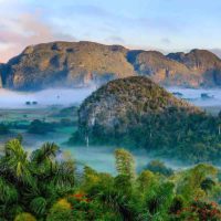 Now that you know the rules of visiting Cuba as an American, be sure to schedule a visit the Viñales Valley. This lush valley is one of 9 UNESCO World Heritage sites in Cuba.