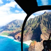 View of the Na Pali Coast of Kauai from inside a helicopter.