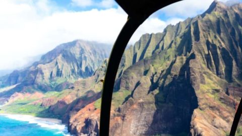 View of the Na Pali Coast of Kauai from inside a helicopter.