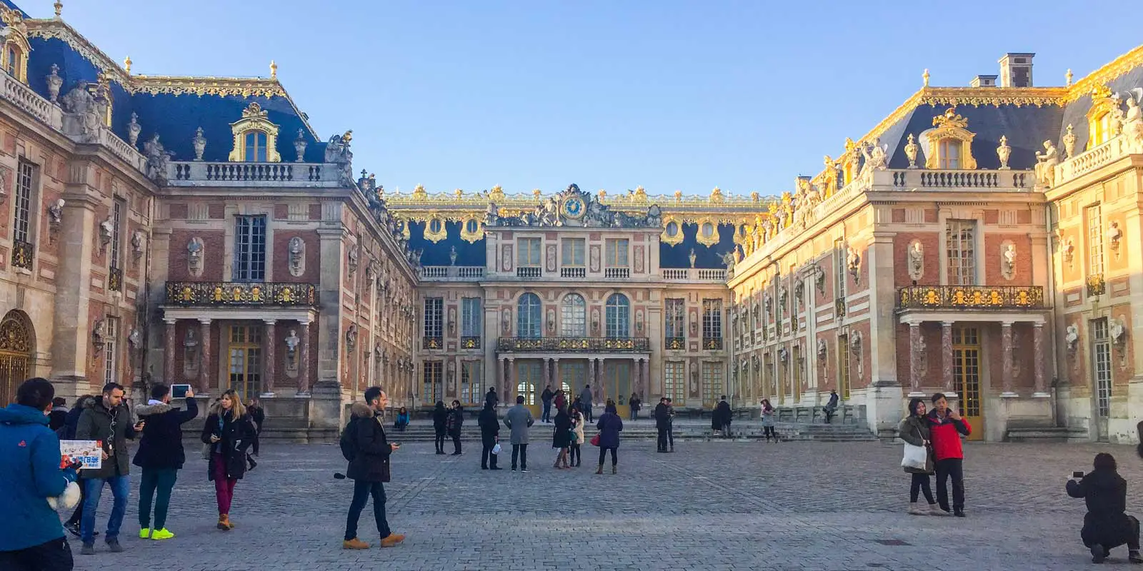 Front courtyard looking at the Château de Versailles in the afternoon sun.