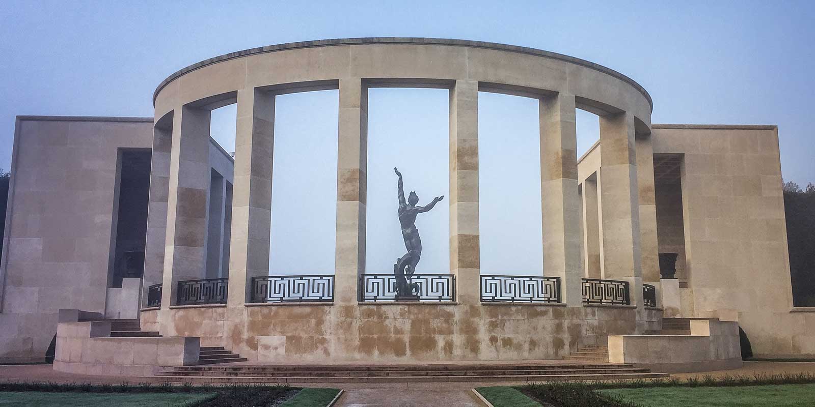 Open air building with a sculpture at the World War II Normandy American Cemetery in France.