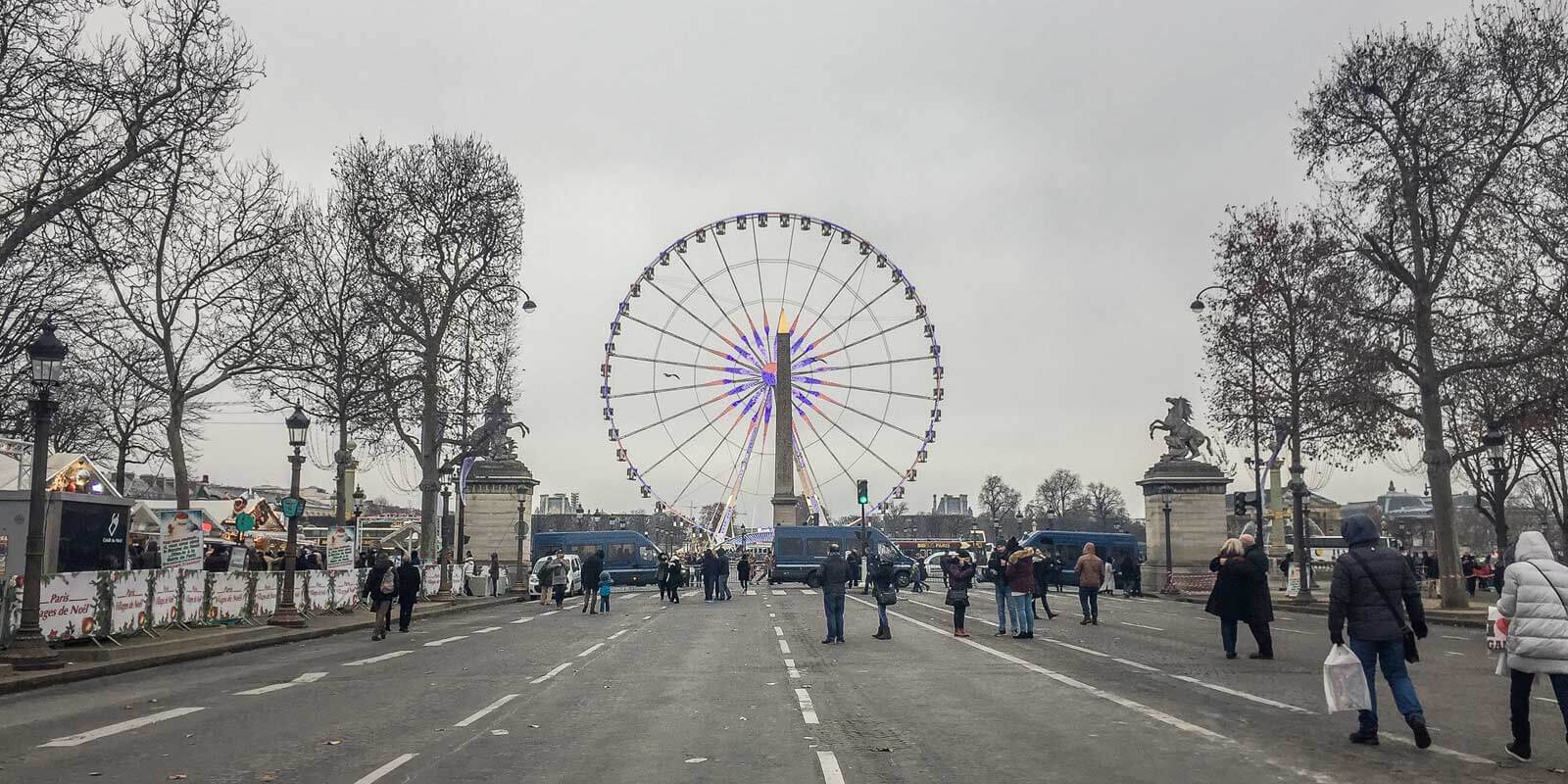Paris' ferris wheel from Avenue des Champs Elysées on a gray Winter day.