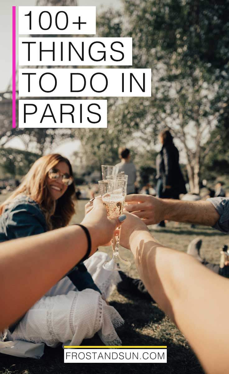 Group of friends picnicking and toasting champagne in a park nearby the Eiffel Tower; overlying text reads "100+ Things to Do in Paris."