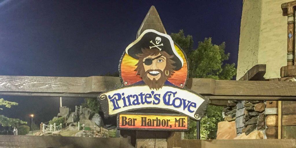 Closeup of a sign for Pirate's Cove Adventure Golf in Bar Harbor, Maine..