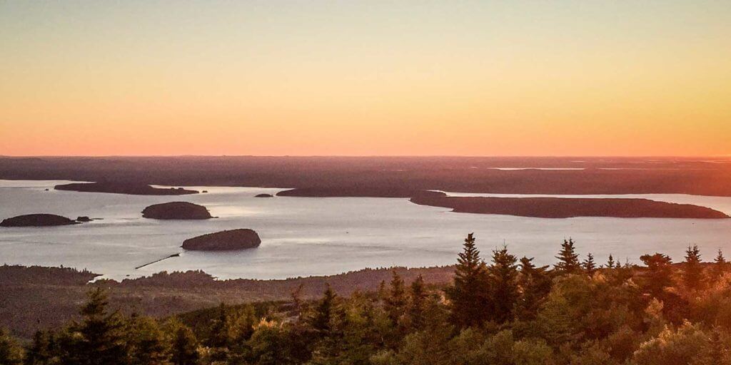 Landscape view looking down on the Porcupine Islands from the top of Cadillac Mountain during sunrise.