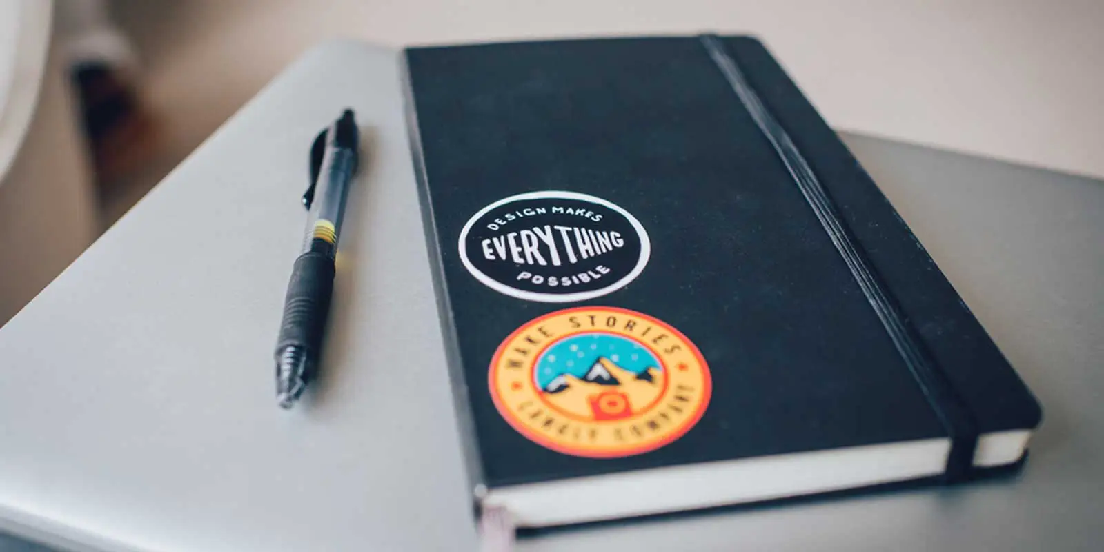 Close up shot of a notebook and pen.