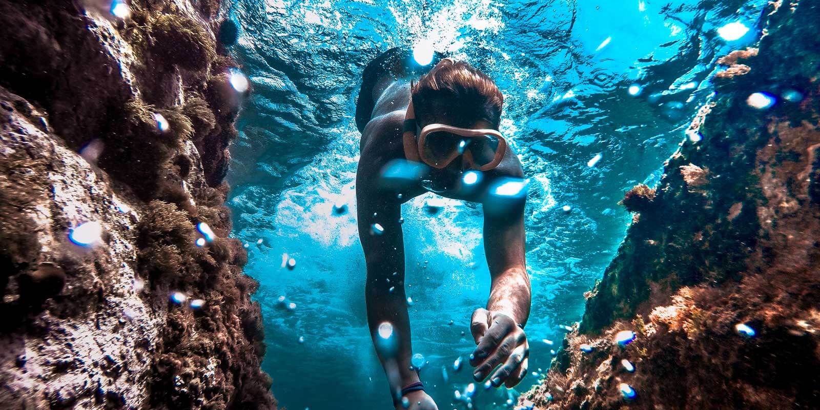 Woman snorkeling amongst coral reef