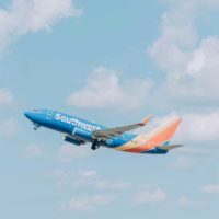 Overhead sky shot of a Southwest Airlines plane flying by.