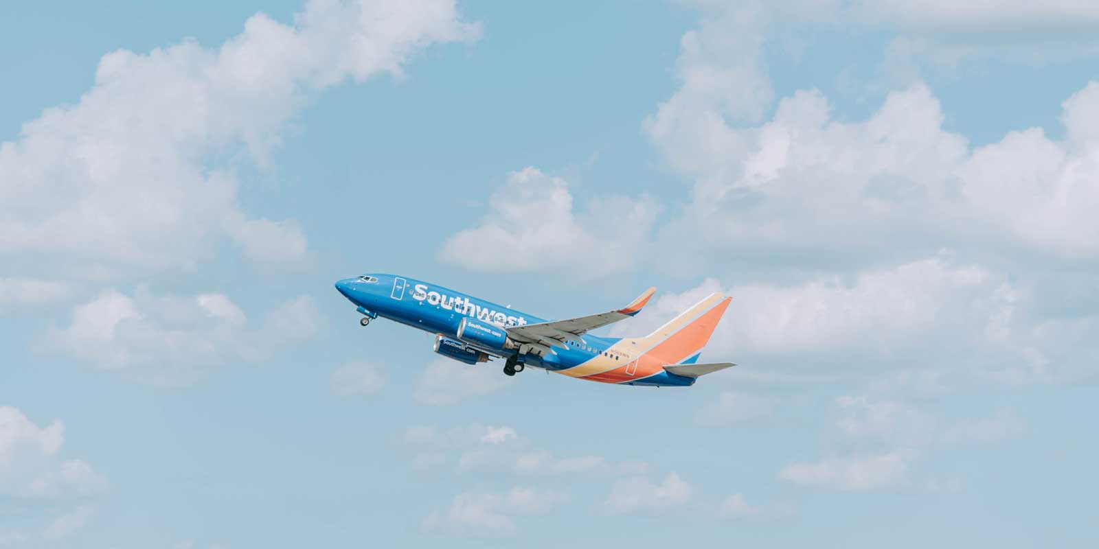 Overhead sky shot of a Southwest Airlines plane flying by.