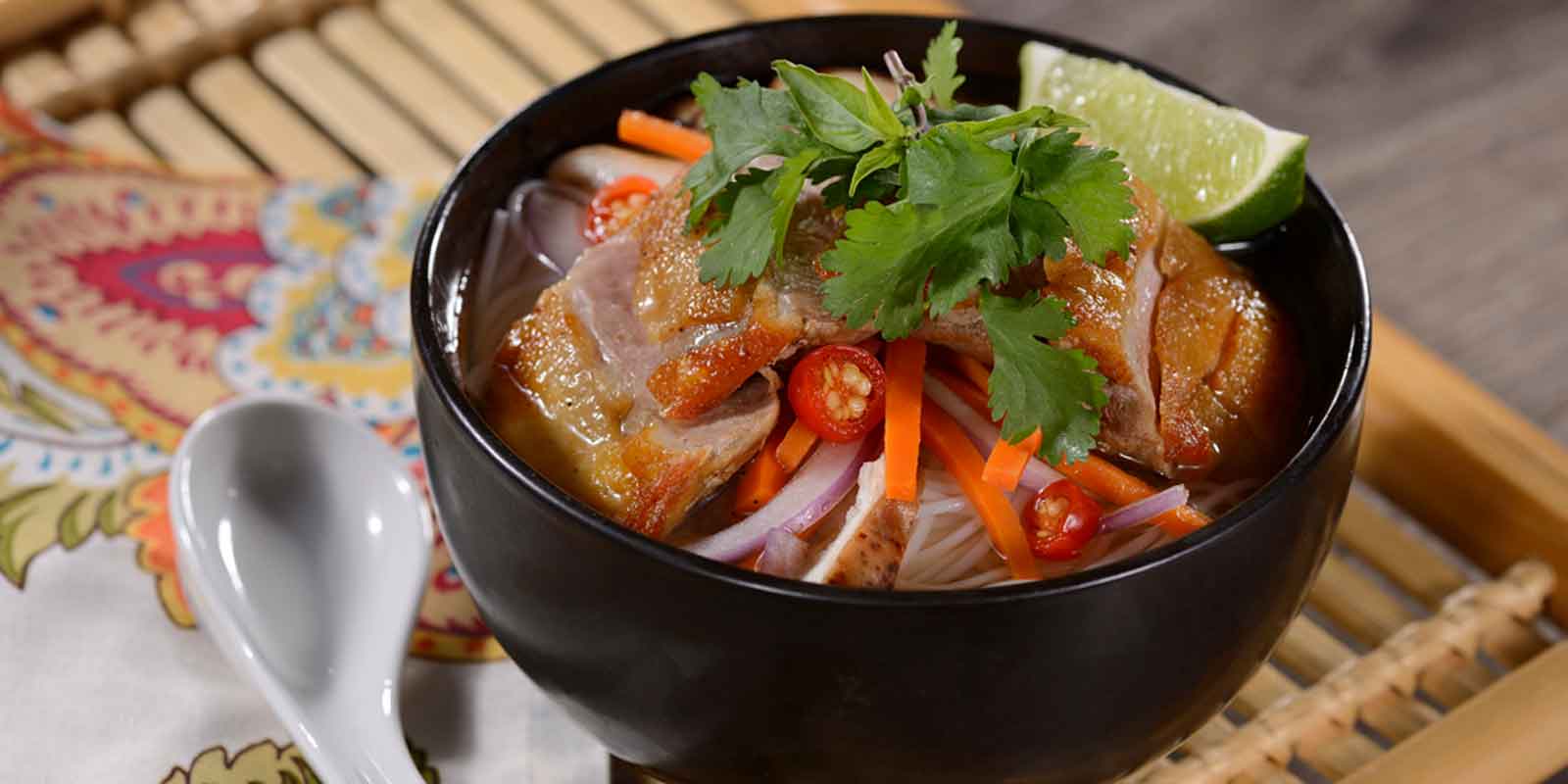 Close up photo of a bowl of Thai style noodles from the Skipper Canteen at Disney World's Magic Kingdom.
