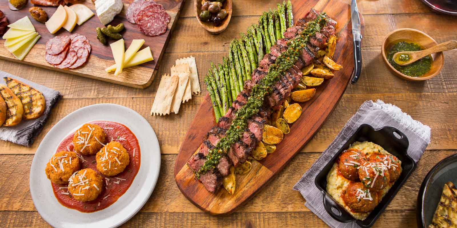 Flat lay photo of several food dishes available at Wine Bar George in Disney Springs.