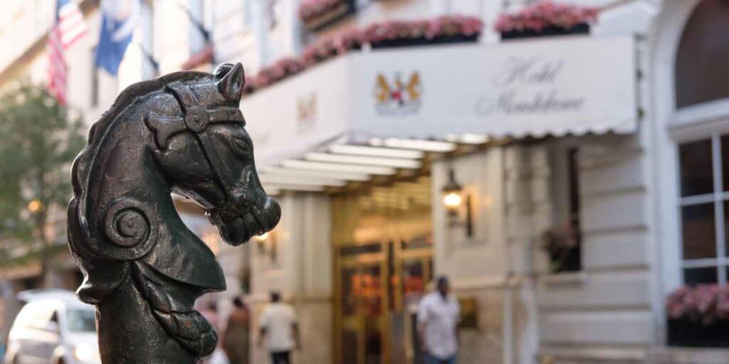 Closeup of an old horse post in New Orleans outside of the Hotel Monteleone entrance.