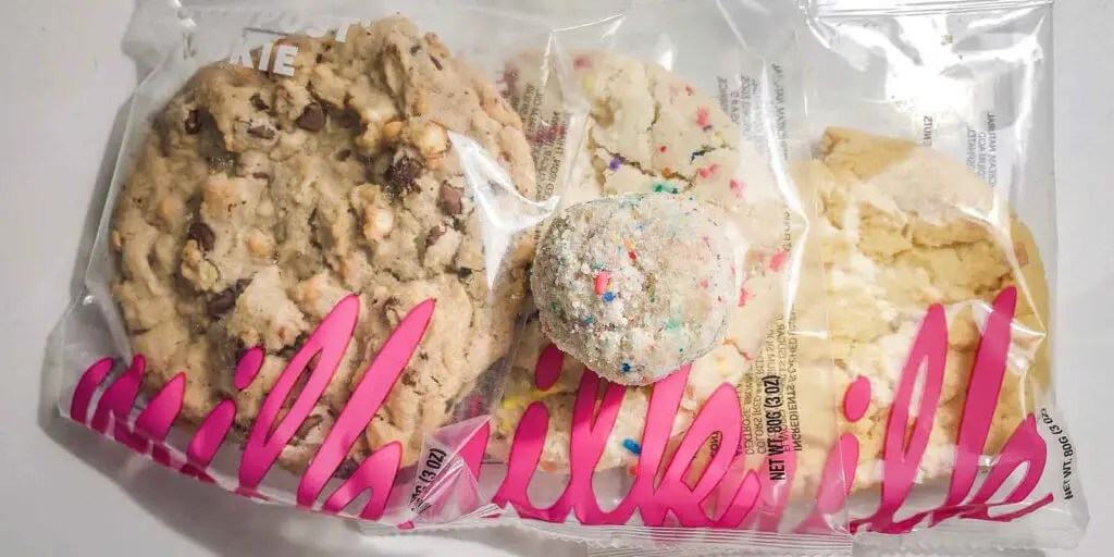 Three prepackaged cookies from Milk, with a birthday truffle on top.