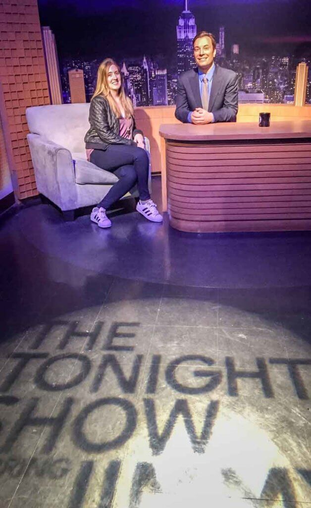 Travel blogger Meg Frost poses with a wax figure of Jimmy Fallon at Madam Tussaud's Wax Museum.