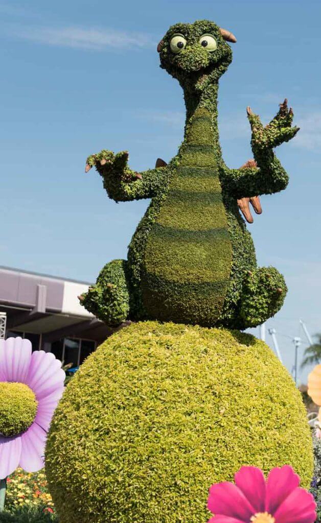 Photograph of a topiary shaped like Figment the dragon at Epcot.