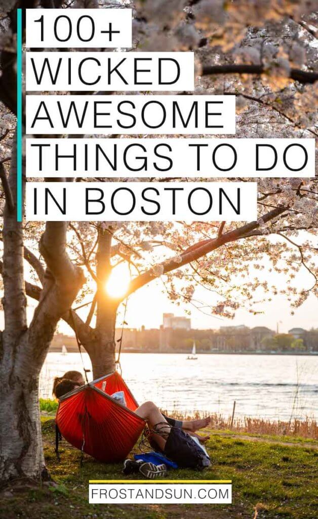 Portrait view of the Charles River Esplanade at sunset with a couple in a red hammock strung between 2 flowering cherry blossom trees. Overlying text reads "100+ Wicked Awesome Things to Do in Boston."