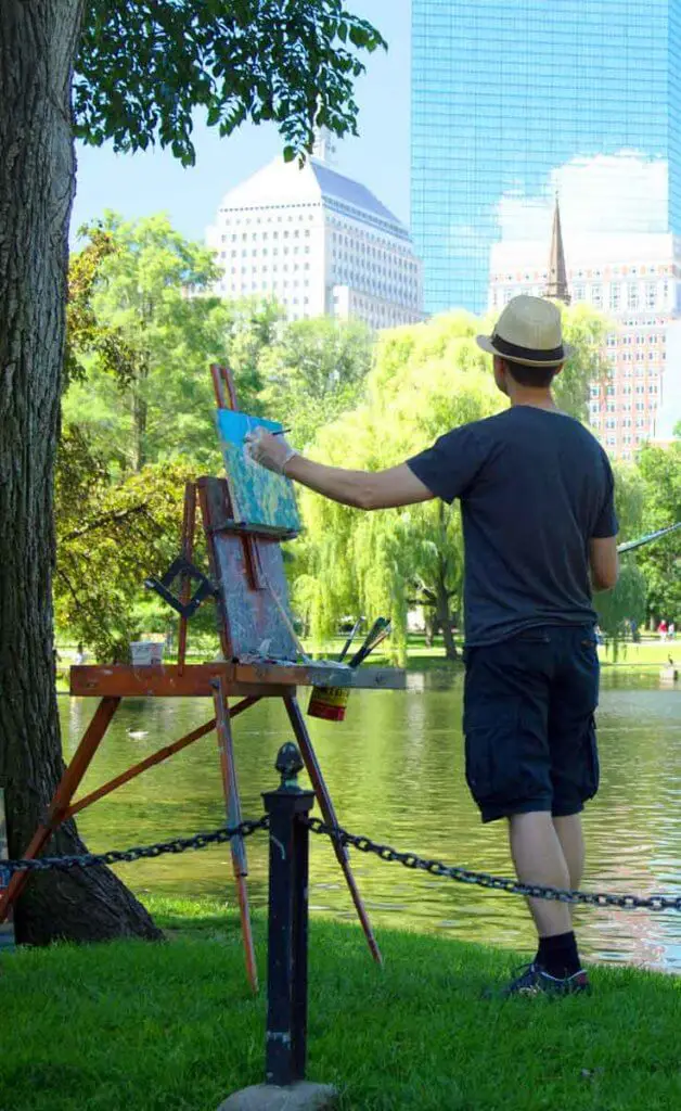 Man paints a landscape in the Boston Public Garden.