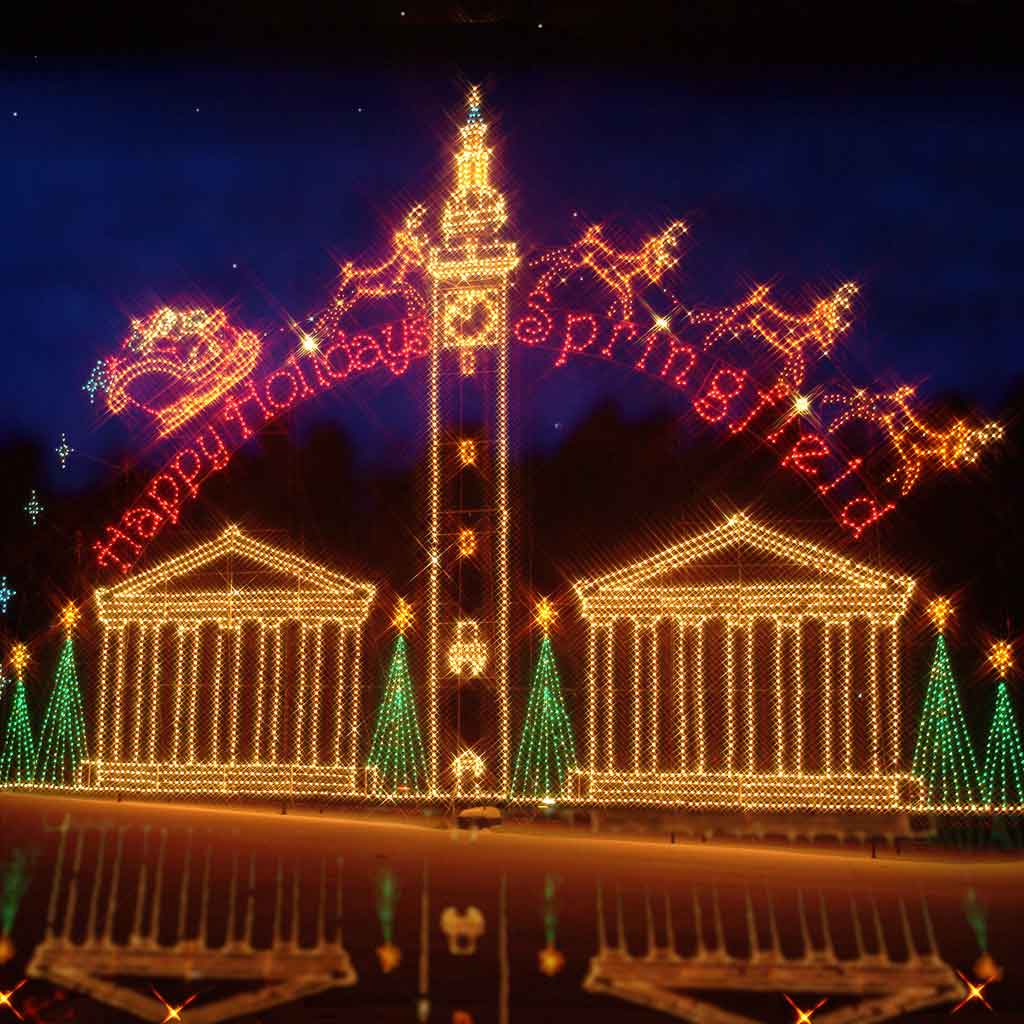 A massive holiday light display at Forest Park in Springfield, MA. The sign reads 