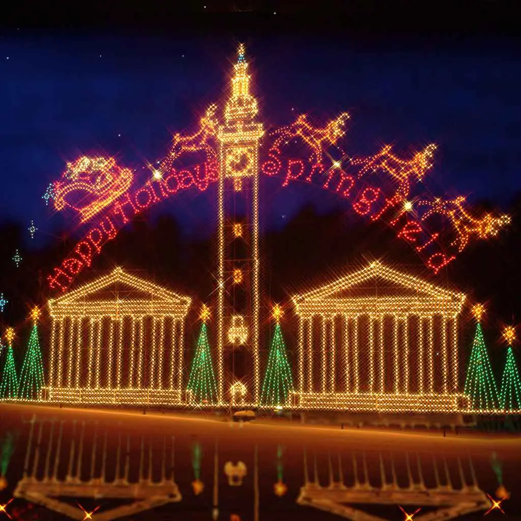 A massive holiday light display at Forest Park in Springfield, MA. The sign reads "Happy Holidays, Springfield."