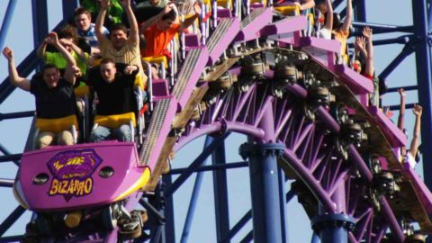 Closeup of people riding the Bizarro roller coaster at Six Flags New England.
