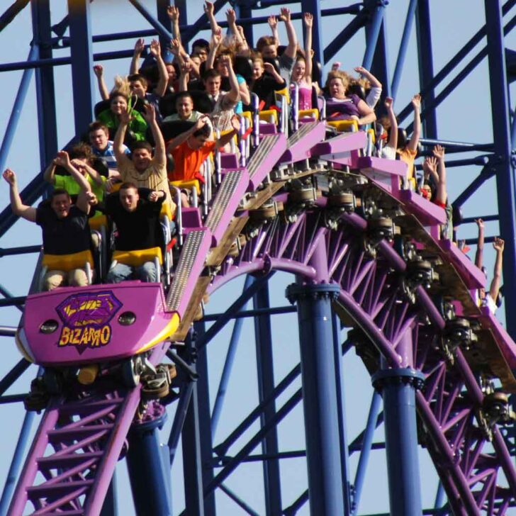 Closeup of people riding the Bizarro roller coaster at Six Flags New England.