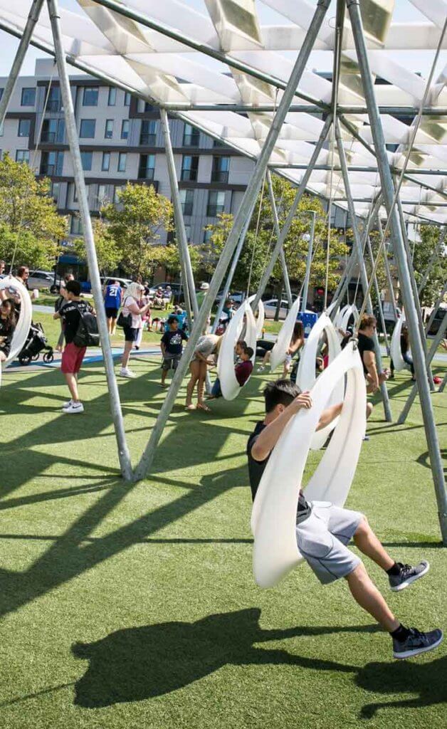 Snapshot of people on the circular swings at The Lawn on D in Boston, MA.