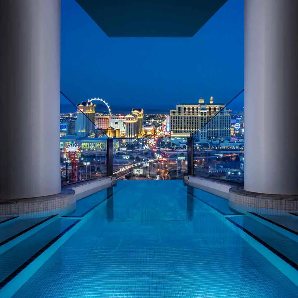 Closeup of an infinity plunge pool looking out over Las Vegas at night.