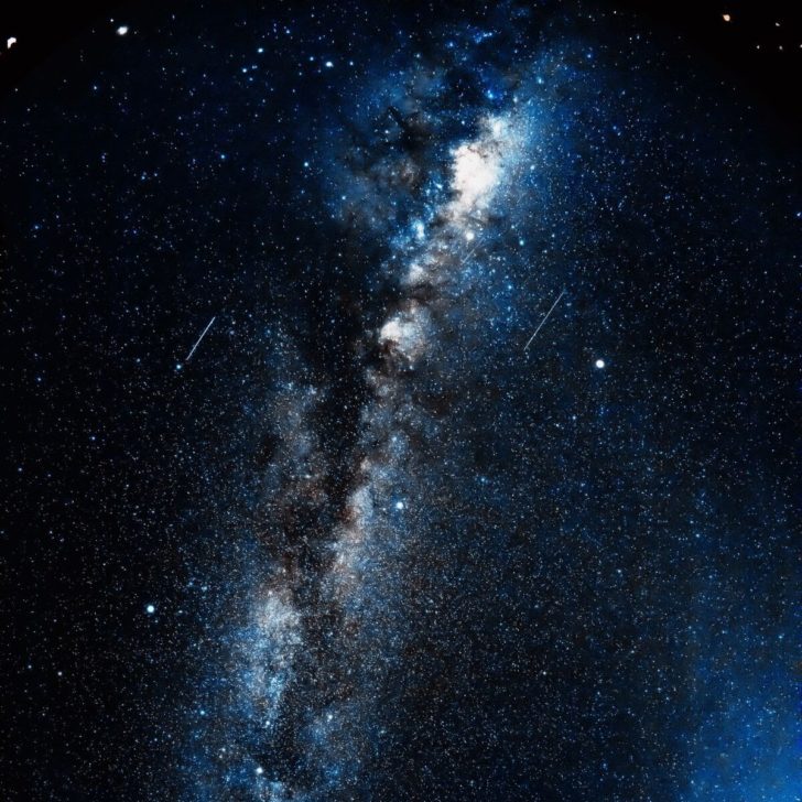 Navy blue sky with millions of stars and constellations and planets, as seen from the islands of Hawaii.