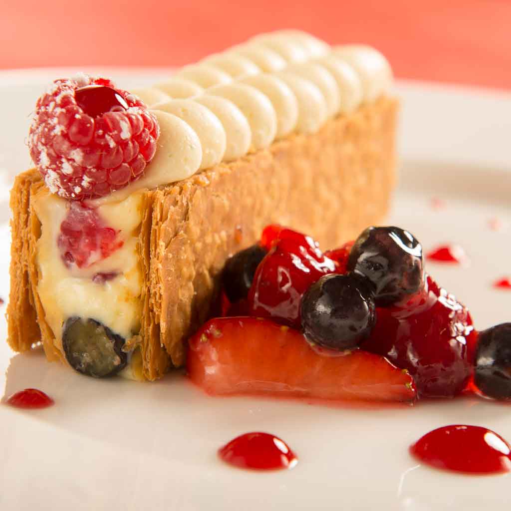 Closeup photo of a pastry-like dessert with berries.