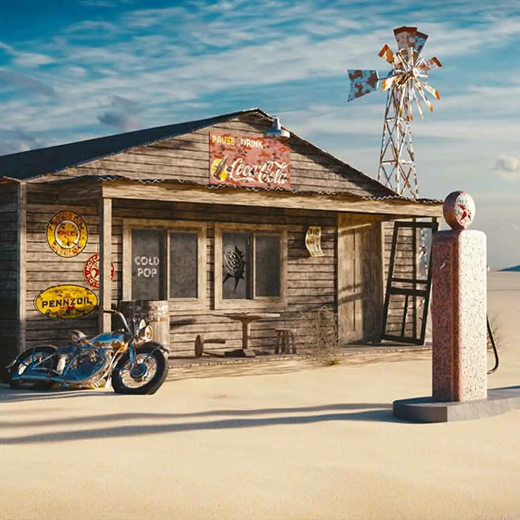 Landscape view of an old, rundown gas station in a desert setting.