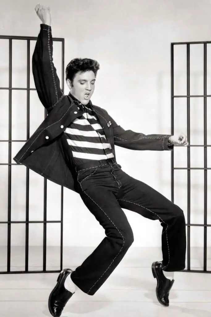 Historical photograph of singer Elvis Presley dancing.