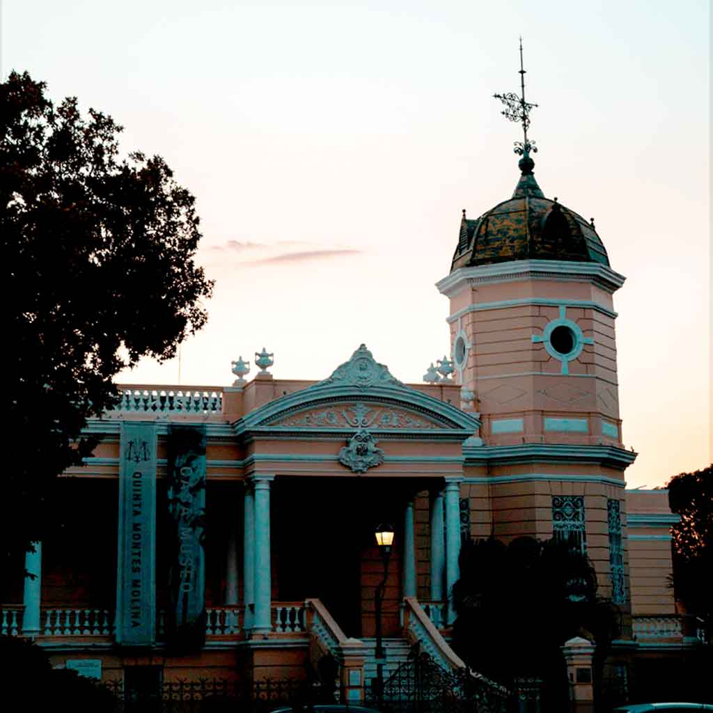 Landscape view of a yellow, ornate building.