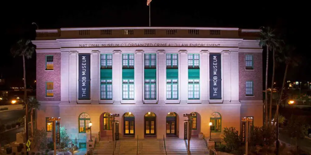 Landscape view of the Mob Museum building at night.