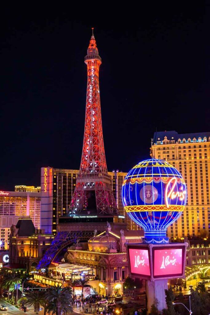 View of the Eiffel Tower replica in Las Vegas at night.