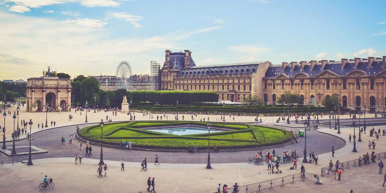 Landscape view of the side of the Louvre museum in Paris.