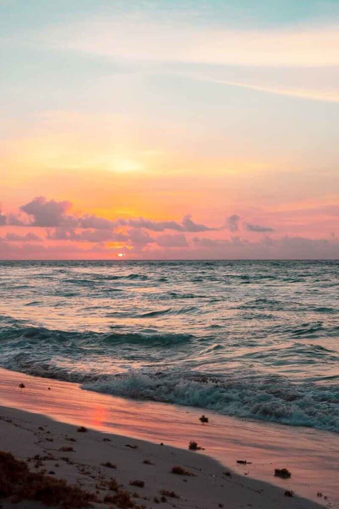 Landscape view of a beach at sunset.