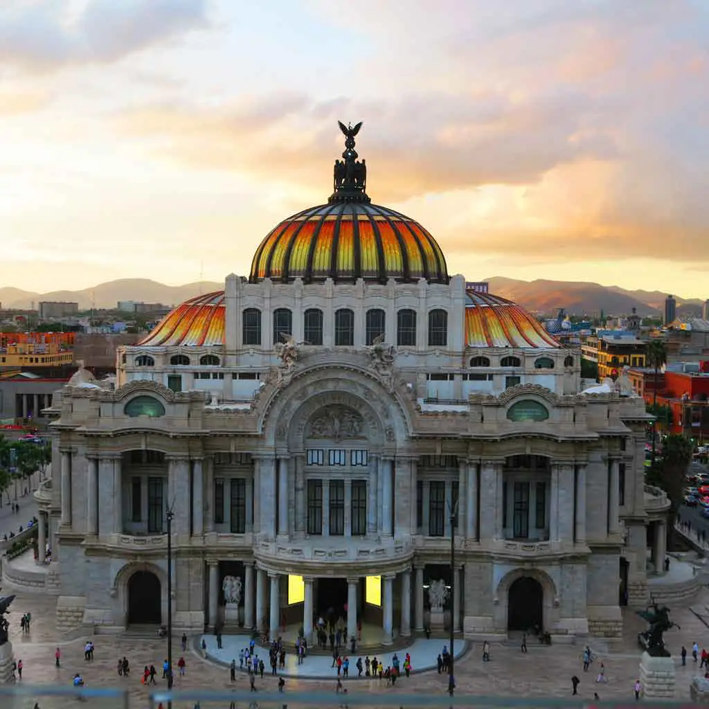 Aerial view of an ornate building with a yellow and orange dome.