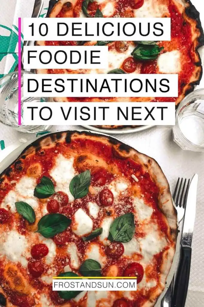 Flat lay photo of 2 pizzas on a table with flatware and drinking glasses. Overlying text reads "10 Delicious Foodie Destinations to Visit Next."