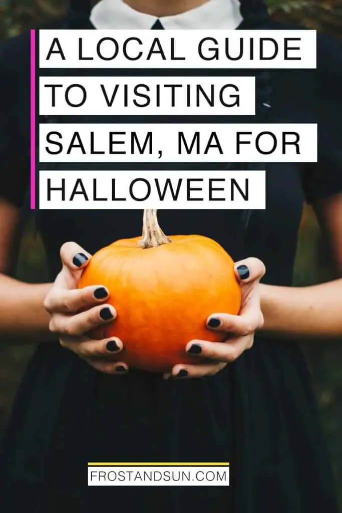 Closeup of a woman wearing a black dress and black nail polish while holding a small pumpkin. Overlying text reads "A Local Guide to Visiting Salem, MA for Halloween."