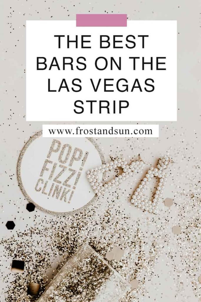 Flat lay photo of a champagne glass on its side with glitter spilling out of it, dangly pearl earrings, and a coaster that says "Pop! Fizz! Clink!" Overlying text reads "The Best Bars on the Las Vegas Strip."