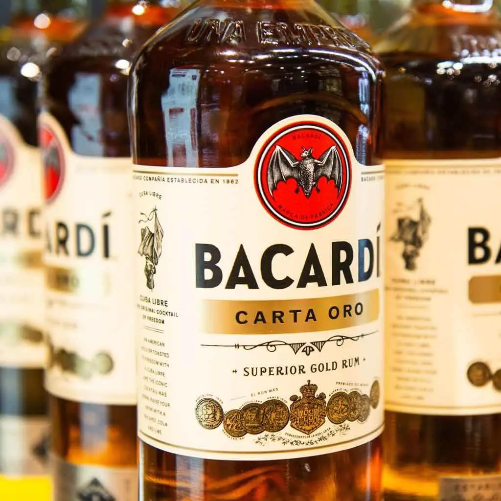 Closeup of bottles of dark Bacardi rum.
