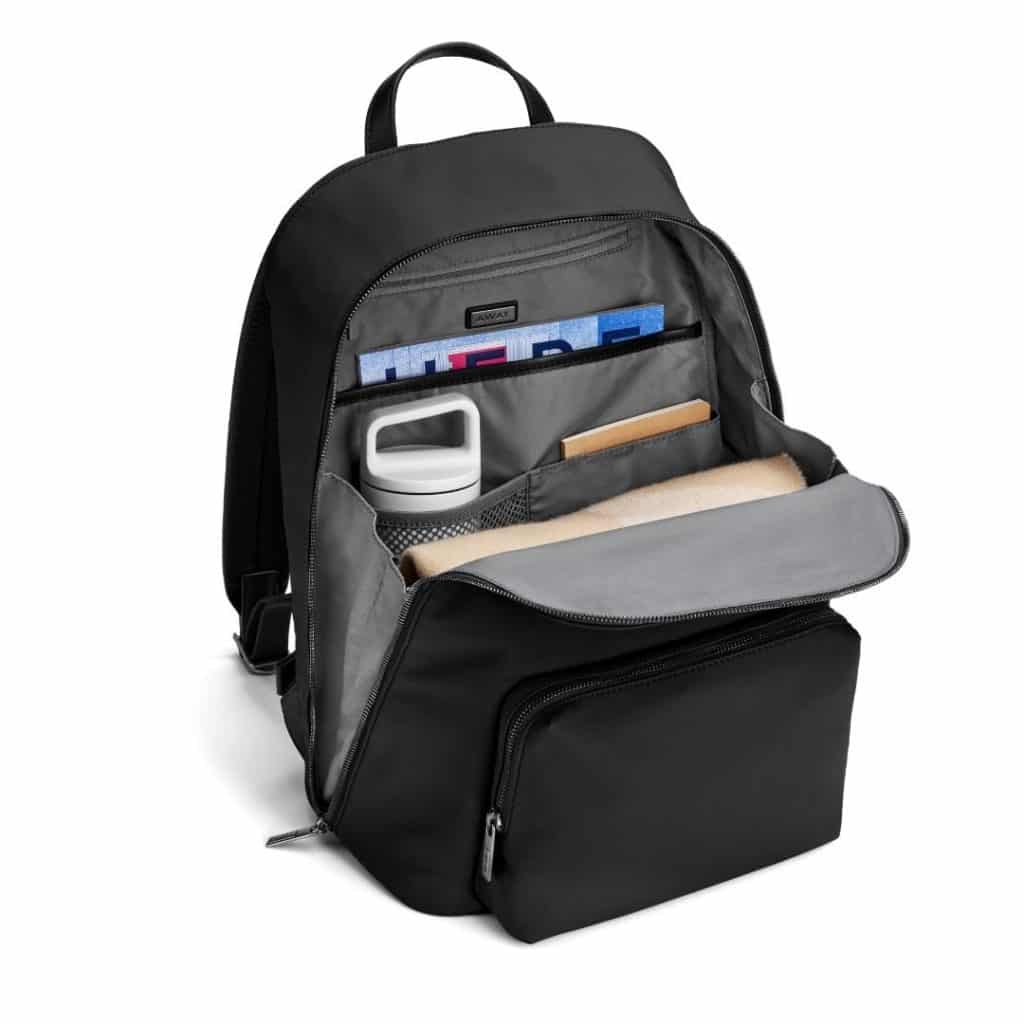 Photo of a backpack open to show its multiple organizational compartments.