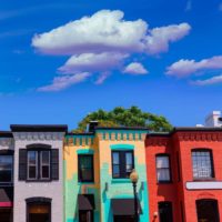 Photo of colorfully painted rowhouses in the Georgetown neighborhood of Washington, DC.